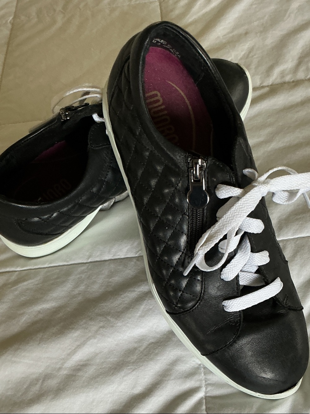 The Munro Emmie black quilted leather sneaker size 7.